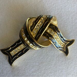 Vintage Joan Rivers black enamel and gold tone brooch